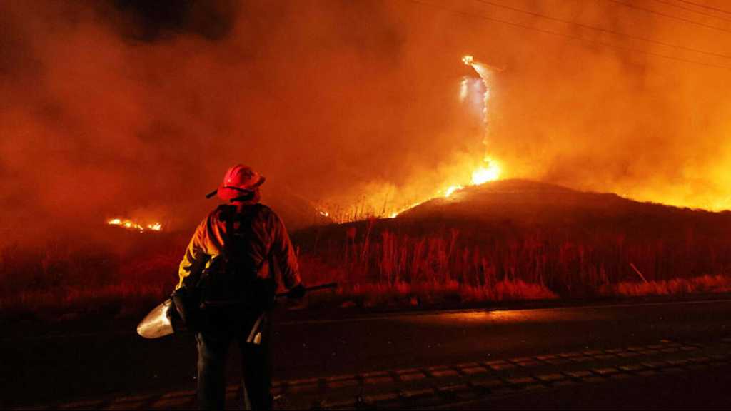 Grèce: la lutte contre les flammes se poursuit, répit de la canicule